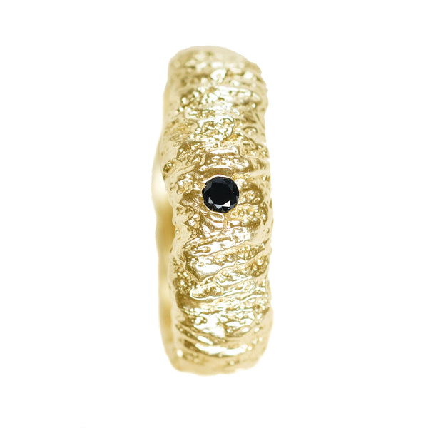The tree trunk inprint wedding band in 14k and 18k white and yellow gold with a black diamond