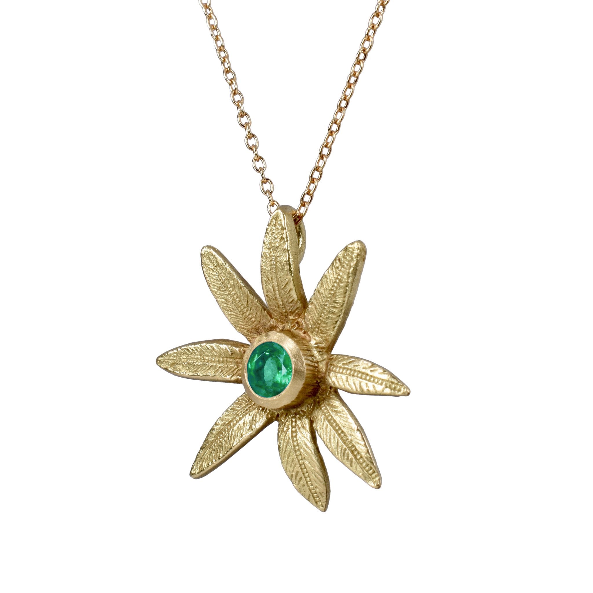 le pendentif fleur en or 18 carats avec une pierre précieuse tsavorite