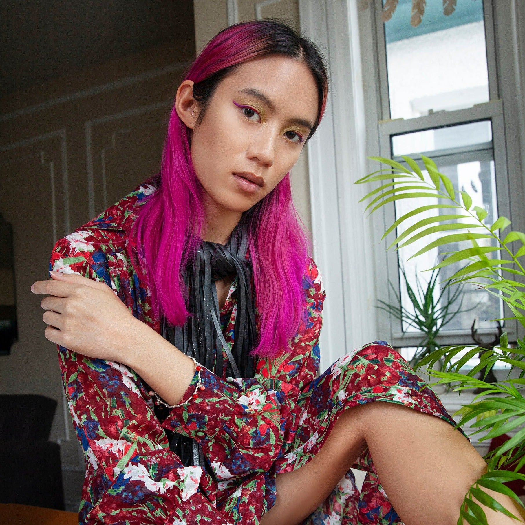 the silver coral beads bangle on a dates' branch