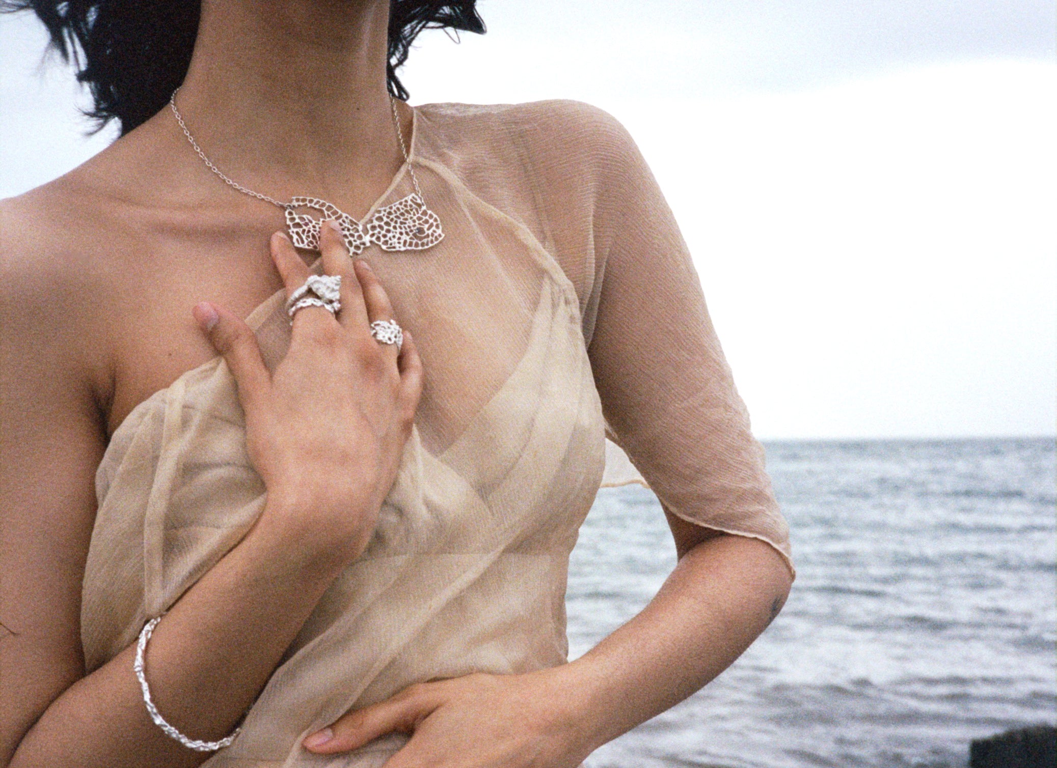 some jewelry pieces on a model