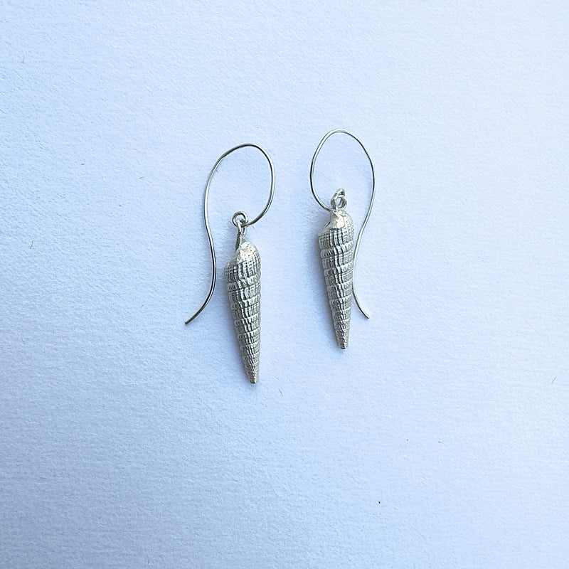the dangle earrings made from casting of seashells