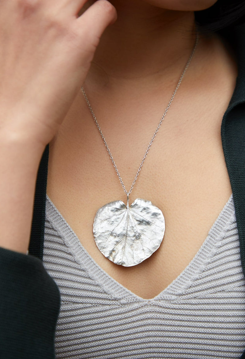 The Corsican leaf lily pad shape heart pendant
