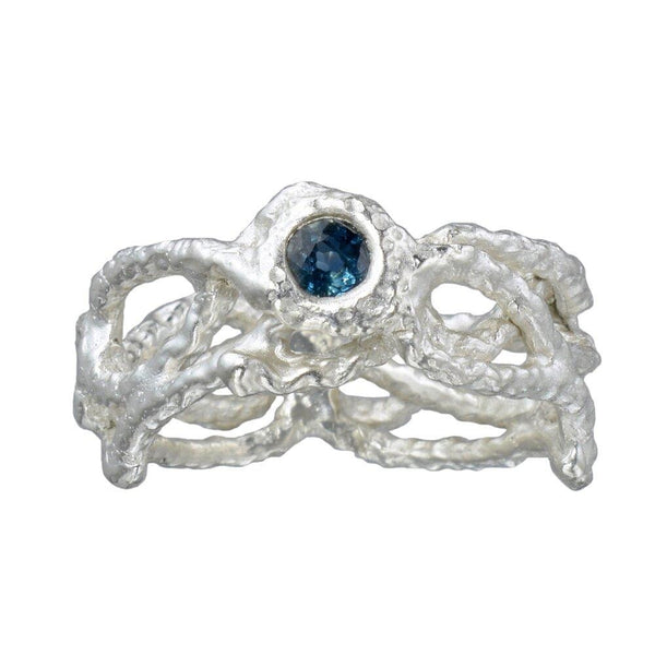 The fishing net ring with a blue sapphire
