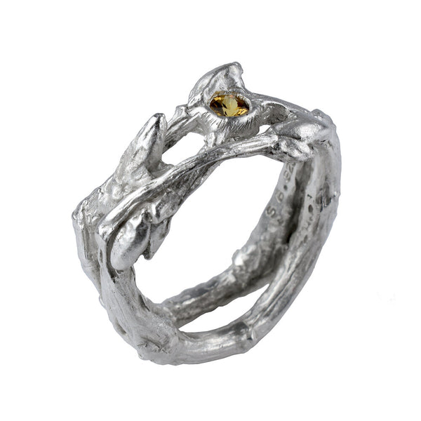 the twig ring made in silver with a yellow sapphire