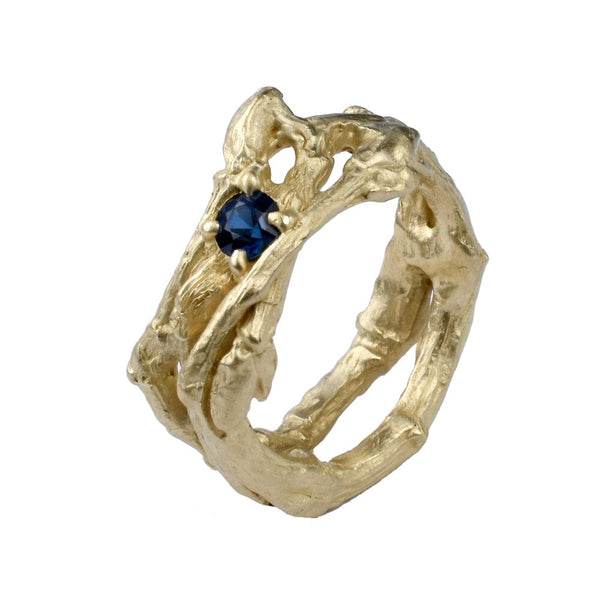 The spring twig branch in 10 K yellow gold with a blue sapphire wedding ring every day wear