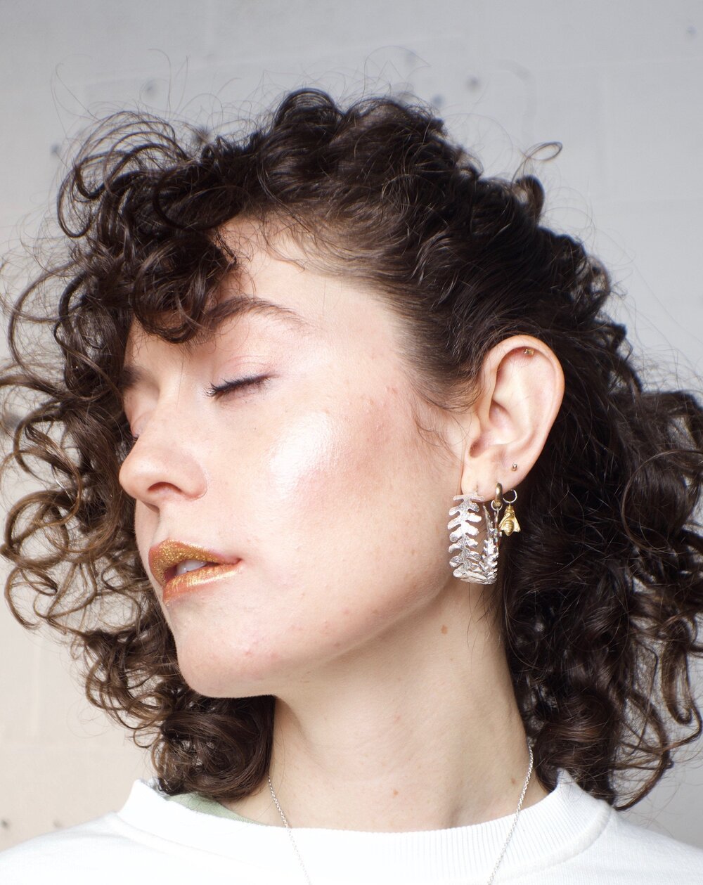 the fern hoop earrings, cast from a fern harvested in France